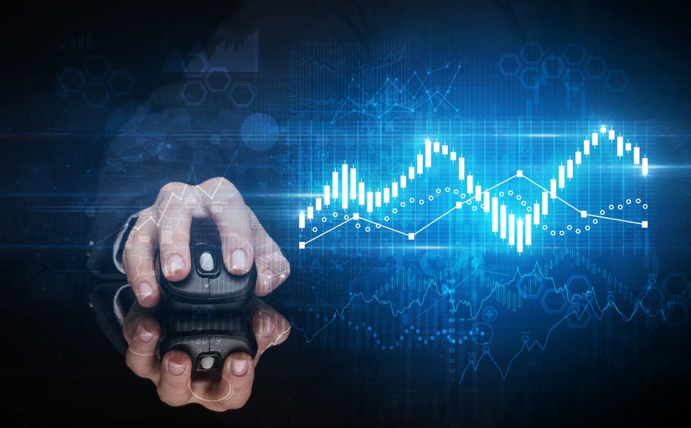 Hand using wireless mouse with statistical concept on dark background Hand using wireless mouse with statistical concept on dark background